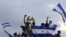 Manifestantes antigubernamentales realizan una protesta para que el presidente nicaragüense Daniel Ortega y su esposa, la vicepresidenta Rosario Murillo, abandonen el poder. (Inti Ocon / AFP).